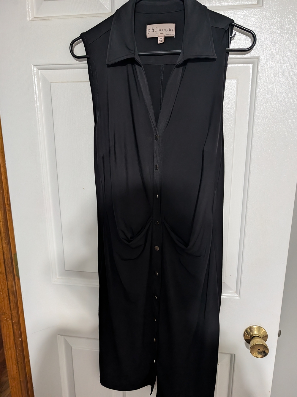 Black sleeveless button-front dress